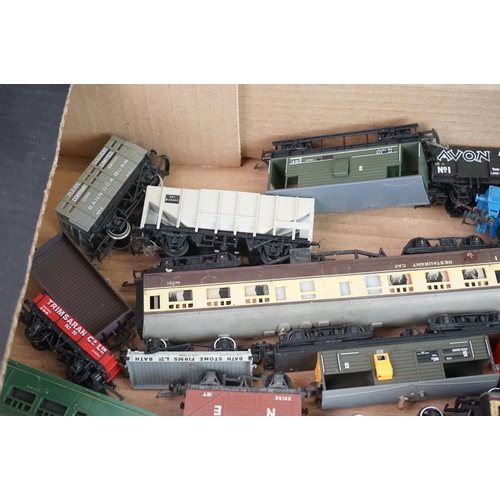 322 - Collection of approximately 42 OO gauge items of rolling stock to include trucks, wagons, coaches, c... 