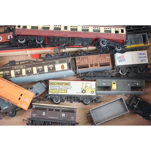 322 - Collection of approximately 42 OO gauge items of rolling stock to include trucks, wagons, coaches, c... 