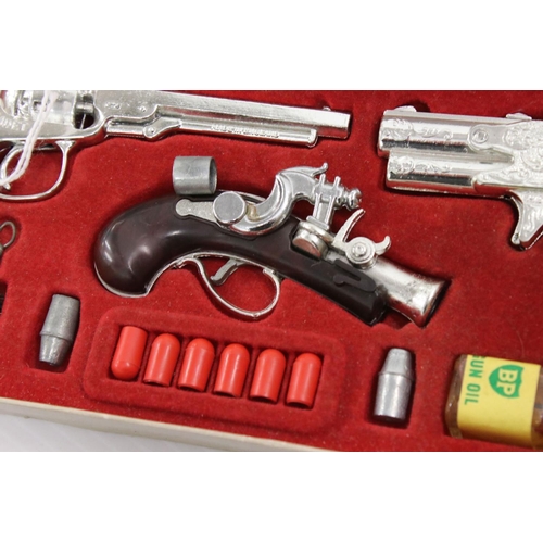 421 - Boxed Outlaw Presentation Case of Miniature Antique Firearms, complete