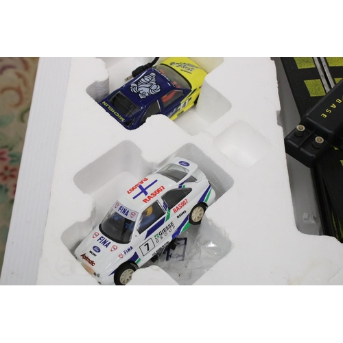 448 - Two boxed Scalextric sets to include Micro Scalextric DBS Supercars (missing one slot car) and Escor... 