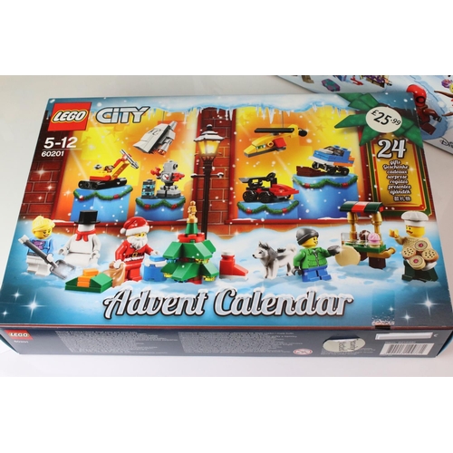 452 - Four boxed Lego advent calendars to include 3 x Star Wars 75184, 72213 and 75279, and Lego City 6020... 