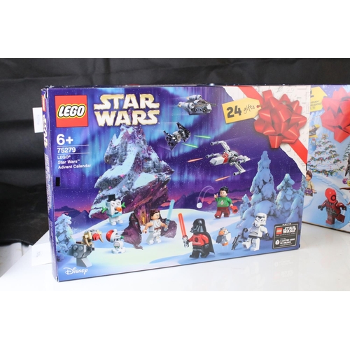 452 - Four boxed Lego advent calendars to include 3 x Star Wars 75184, 72213 and 75279, and Lego City 6020... 