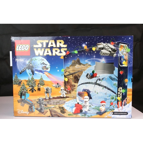 452 - Four boxed Lego advent calendars to include 3 x Star Wars 75184, 72213 and 75279, and Lego City 6020... 