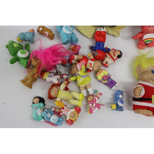 460 - Collection of Circa 80's soft toys and figurines to include Care Bears, Troll Dolls, Ed the Duck and... 