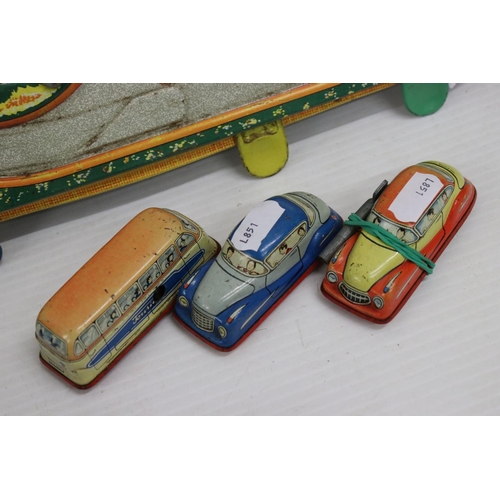 463 - Group of clockwork and tin plate toys to include Western Cowboy with Cart (China), Zig-Zag Express, ... 