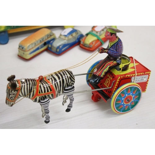 463 - Group of clockwork and tin plate toys to include Western Cowboy with Cart (China), Zig-Zag Express, ... 