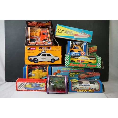 473 - 10 x Boxed battery operated and wind up toys to include BMW M1, Motorschift MS 65, Superschnelle Ren... 