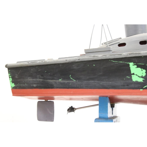 1266 - Scratch built wooden model boat, painted and on stand, showing wear