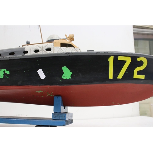 1266 - Scratch built wooden model boat, painted and on stand, showing wear