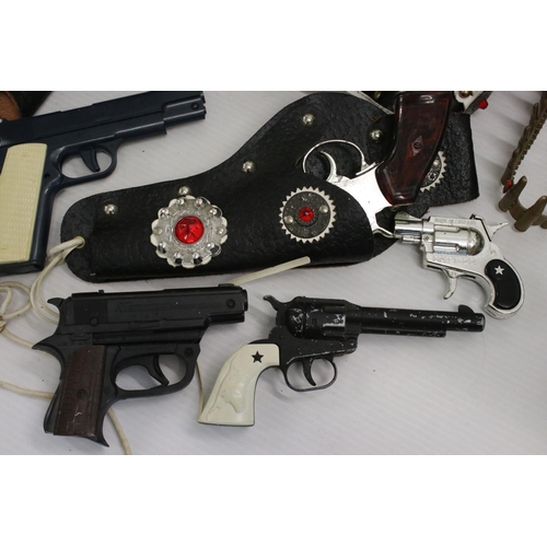 428 - Quantity of vintage toy guns, holsters and accessories to include Lone Star, play wear