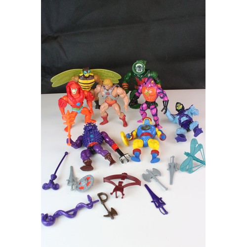 384 - Eight original Mattel Masters of the Universe figures to include He Man, Skeletor, Buzz Off, Spikor,... 