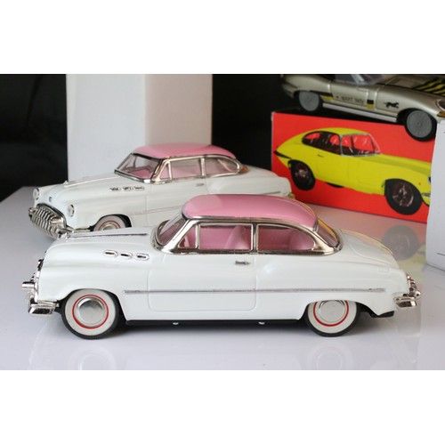 1234 - Two boxed tin plate friction powered cars in pink & white, plus a boxed Sport Lady Jaguar in silver,... 