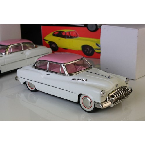 1234 - Two boxed tin plate friction powered cars in pink & white, plus a boxed Sport Lady Jaguar in silver,... 