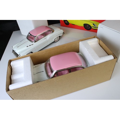 1234 - Two boxed tin plate friction powered cars in pink & white, plus a boxed Sport Lady Jaguar in silver,... 