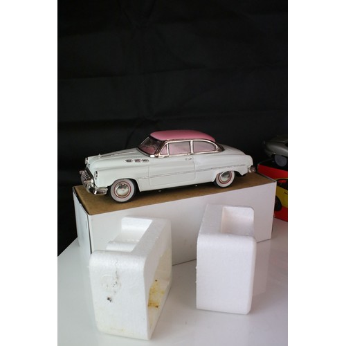 1234 - Two boxed tin plate friction powered cars in pink & white, plus a boxed Sport Lady Jaguar in silver,... 