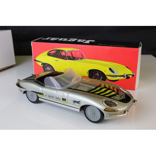 1234 - Two boxed tin plate friction powered cars in pink & white, plus a boxed Sport Lady Jaguar in silver,... 