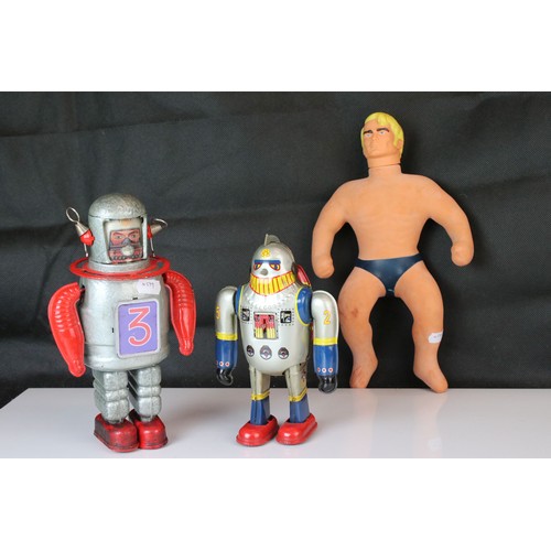 500 - Two tinplate clockwork toys, one in the design of a robot and the other an astronaut, plus a playwor... 