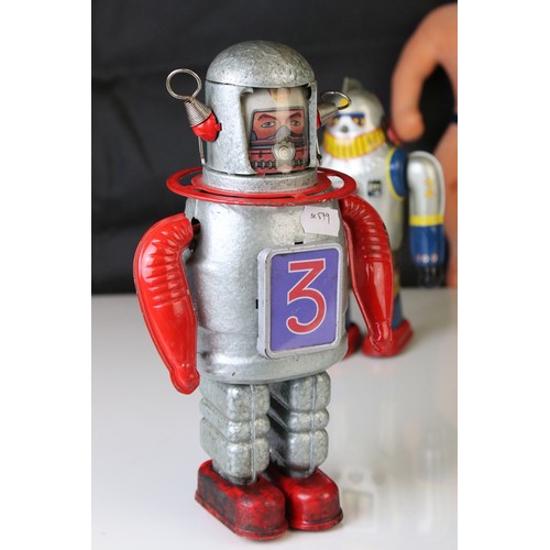 500 - Two tinplate clockwork toys, one in the design of a robot and the other an astronaut, plus a playwor... 