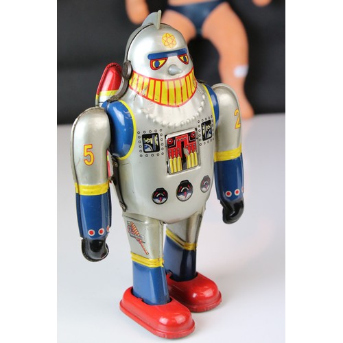 500 - Two tinplate clockwork toys, one in the design of a robot and the other an astronaut, plus a playwor... 