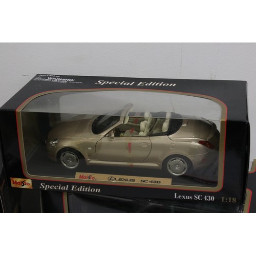 1210 - Eight boxed Maisto diecast models to include 7 x 1:18 scale models featuring Jaguar XK8, Jaguar XJ22... 