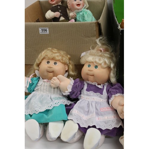 556 - Quantity of various plastic contemporary baby dolls to include a Zapf Creation Nana doll with tag (t... 