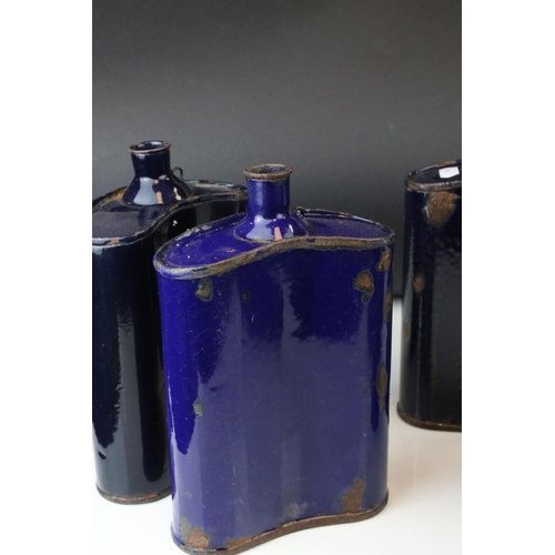 58 - A set of five vintage blue metal enamel Flasks.