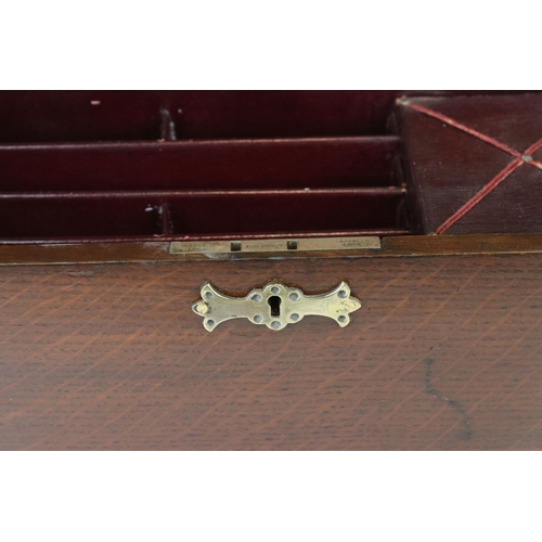 121 - An early 20th century oak stationary cabinet with fitted interior and brass mounts.