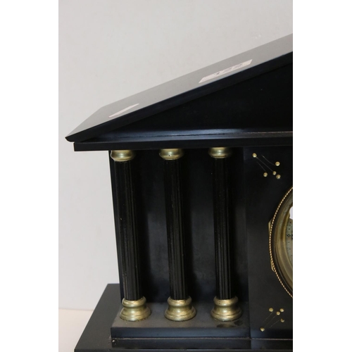 122 - An antique slate mantel clock of classical form with two train movement.