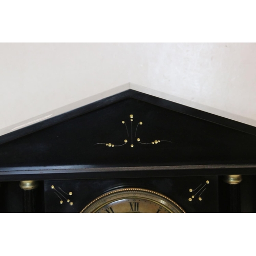122 - An antique slate mantel clock of classical form with two train movement.