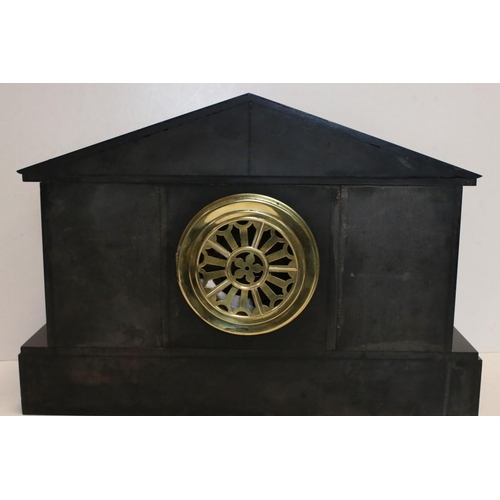 122 - An antique slate mantel clock of classical form with two train movement.