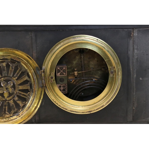122 - An antique slate mantel clock of classical form with two train movement.