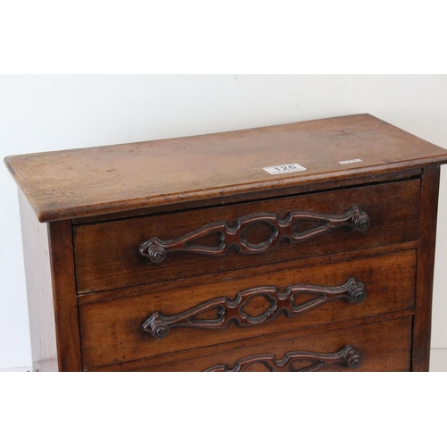 126 - A 19th century continental miniature chest of three long drawers, W: 20cm, H: 45.5cm