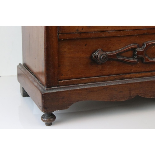 126 - A 19th century continental miniature chest of three long drawers, W: 20cm, H: 45.5cm