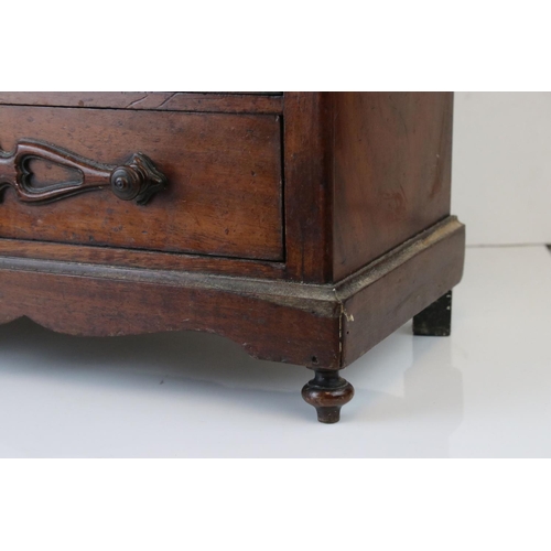 126 - A 19th century continental miniature chest of three long drawers, W: 20cm, H: 45.5cm