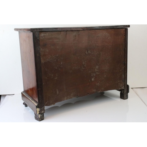 126 - A 19th century continental miniature chest of three long drawers, W: 20cm, H: 45.5cm