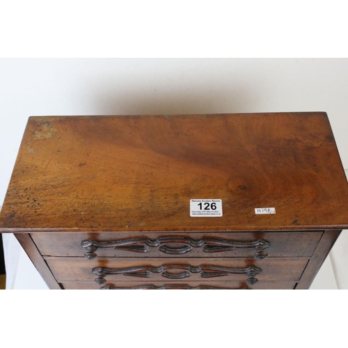 126 - A 19th century continental miniature chest of three long drawers, W: 20cm, H: 45.5cm