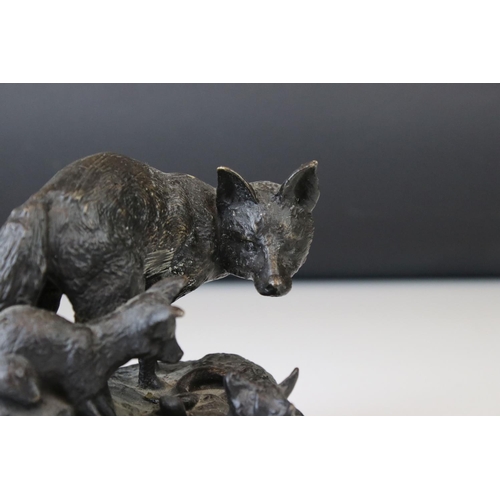 141 - A bronze sculpture of a fox and her cubs signed Fratin.