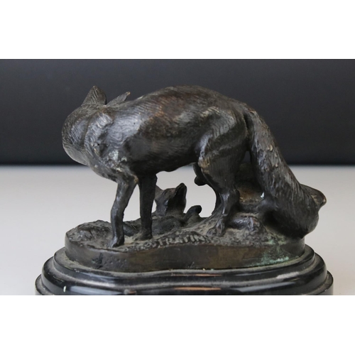 141 - A bronze sculpture of a fox and her cubs signed Fratin.