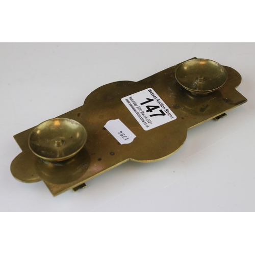 147 - An antique brass desk top pen tray.