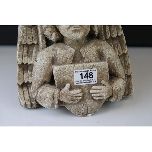 148 - A plaster wall bracket of medieval design in the form of an Angel holding a shield.