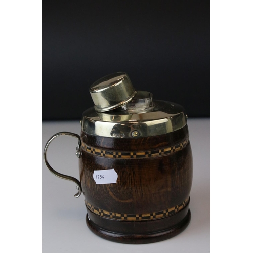 149 - A 20th century oak and plated tea caddy in the form of a cup or tankard.