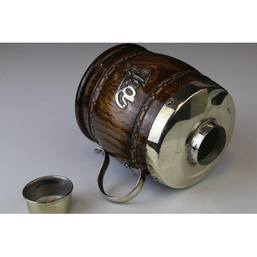 149 - A 20th century oak and plated tea caddy in the form of a cup or tankard.