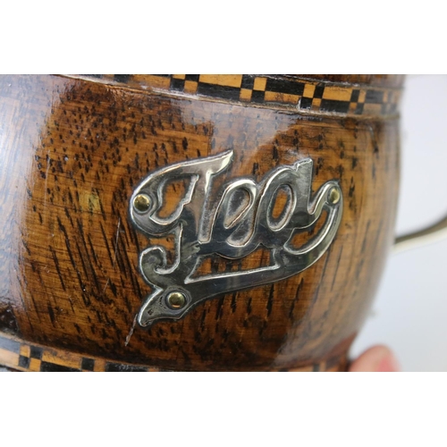 149 - A 20th century oak and plated tea caddy in the form of a cup or tankard.