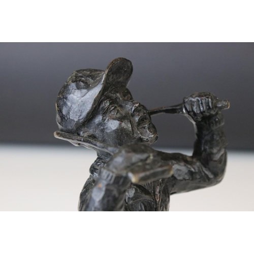 151 - A bronze sculpture of a golfer bending a club round his neck.
