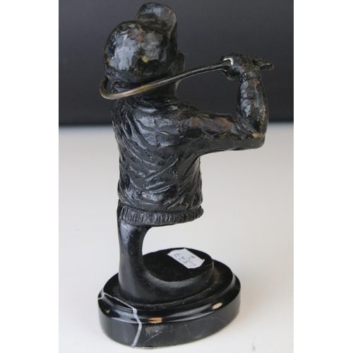151 - A bronze sculpture of a golfer bending a club round his neck.