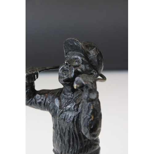 151 - A bronze sculpture of a golfer bending a club round his neck.