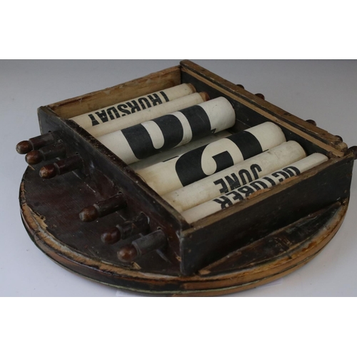 152 - Late 19th / Early 20th Wooden Cased Circular Perpetual Wall Calendar with apertures for day, date an... 