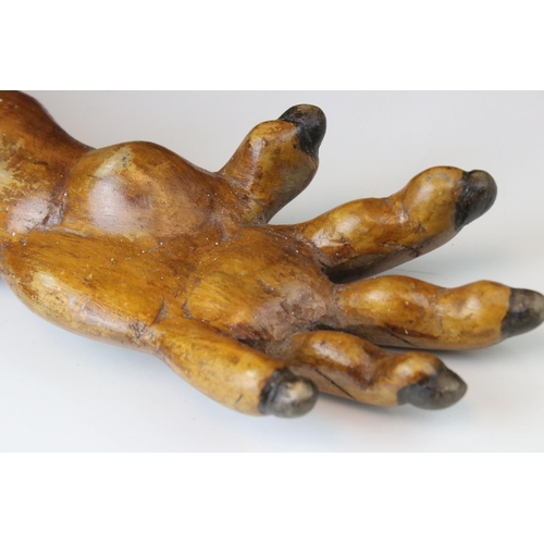 153 - A carved wooden treen human arm.