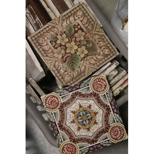 156 - A large quantity of ceramic tiles to include Art Nouveau and Victorian.