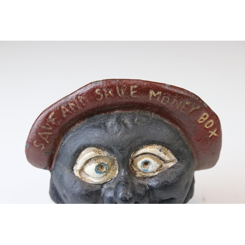 160 - A novelty cast iron money box in the form of a funny man .inscribed Save and Save